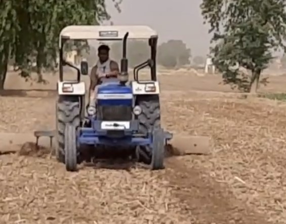 Ravi Kumar Sihag while farming at his home town