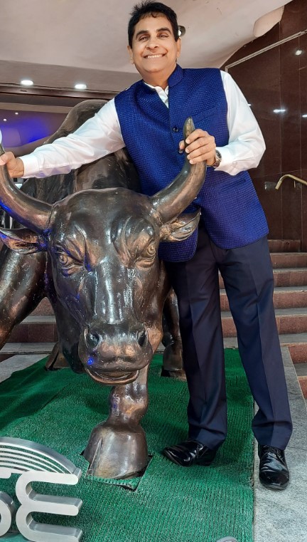 Vijay Kedia posing with a bull