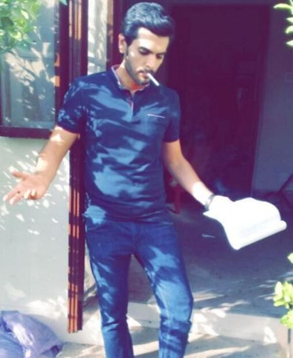 Yasir Shoro while smoking cigarette 