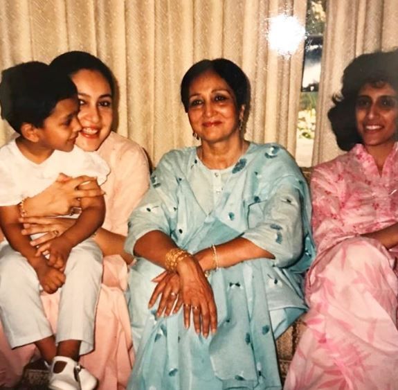 Ali Sethi sitting in his mother's lap with his maternal grandmother, and maternal aunt, Moni Mohsin (left to right)