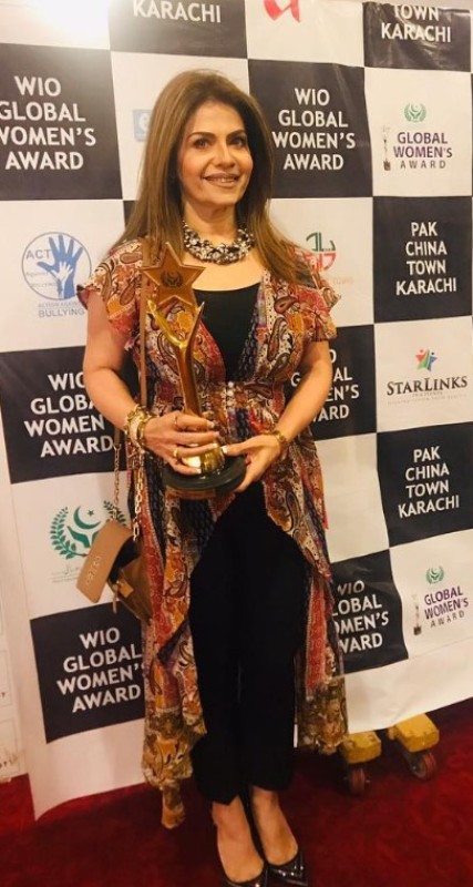 Amber Khan holding Global Women's Award