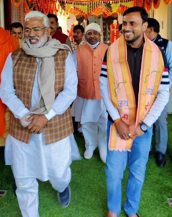 Anuj Chaudhary with Swatantra Dev Singh (left)