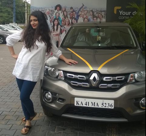 Divya with her Renault car
