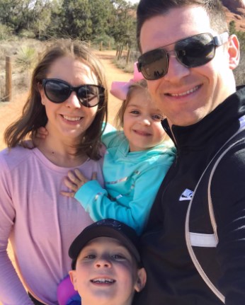 James DiNicolantonio posing with his wife, daughter, and son