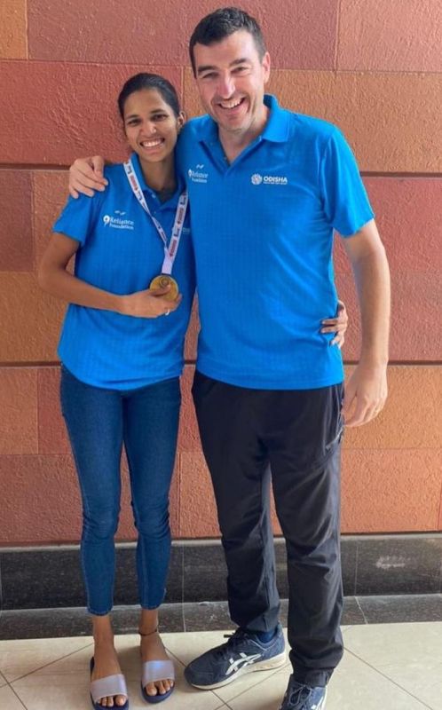 Jyothi Yarraji with her coach, James Hillier (right)