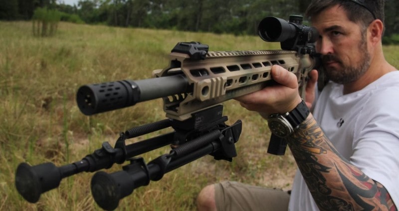 Navy SEAL Marcus Luttrell posing for a photo with the rifle manufactured in honour of Matthew by Axelson Tactical