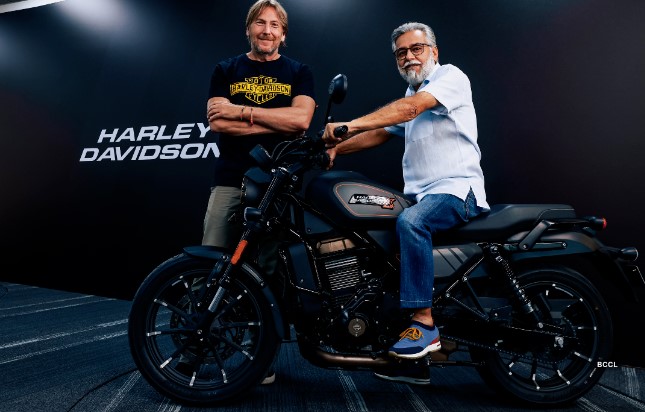 Pawan Munjal posing with a Harley Davidson bike