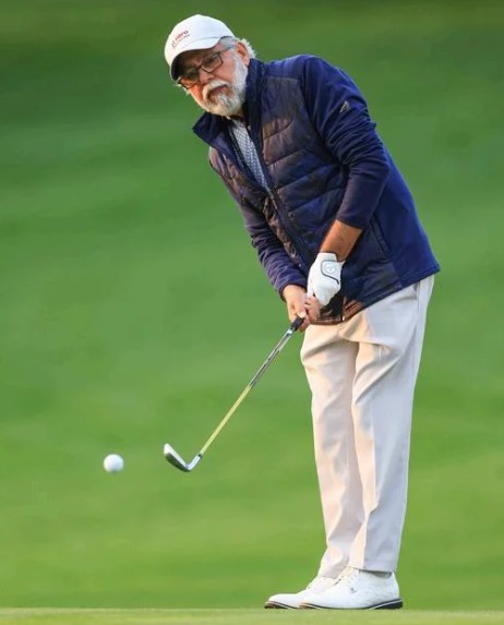 Pawan Munjal while playing golf