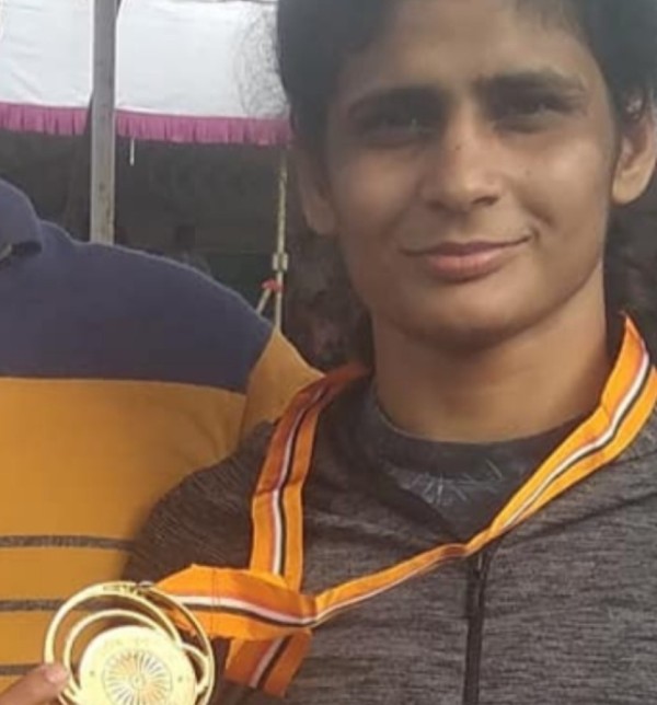 Rani Rana holding Gold Medal after winning National Women's Wrestling Competition