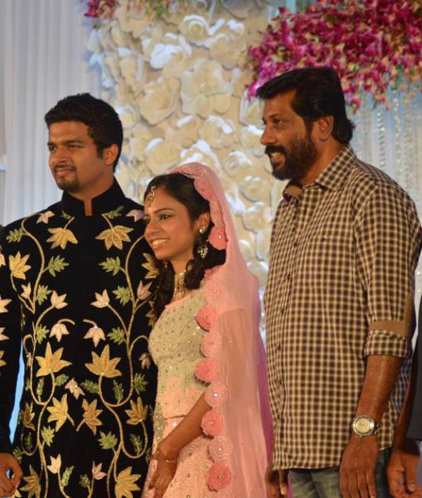 Siddique Ismail with her daughter Sara and son-in-law at their wedding reception