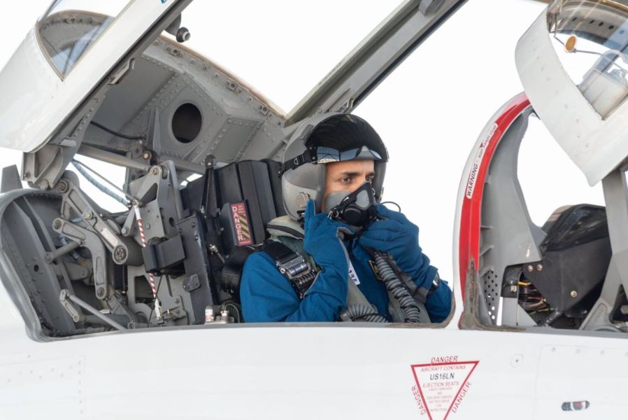 Sultan sitting inside a fighter aircraft while undergoing training as an astronaut
