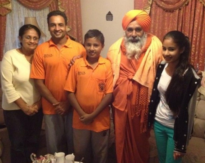 Tanveer Sangha (centre) with his sister (extreme right), his mother, Upneet Sangha (extreme left), and his father, Joga Sangha (second from left)