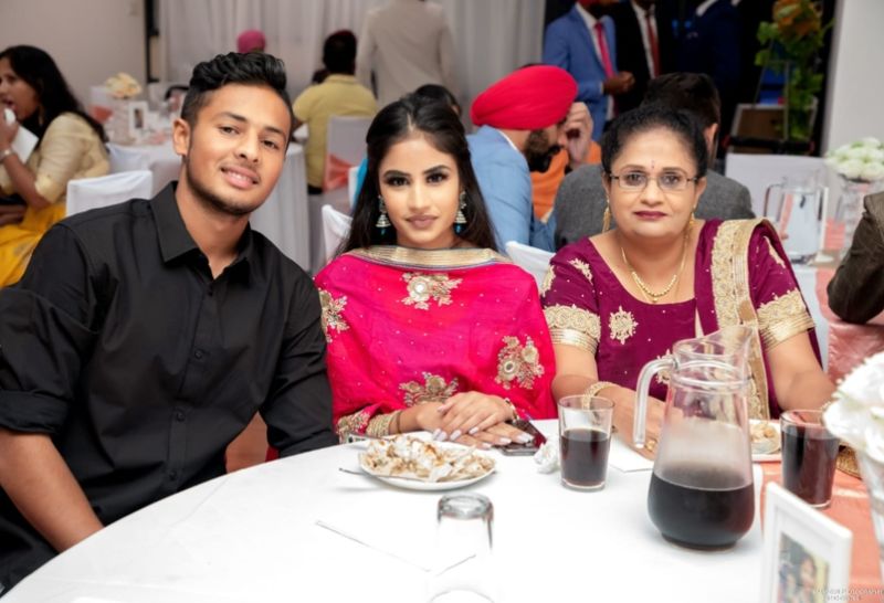 Tanveer Sangha with his sister and mother