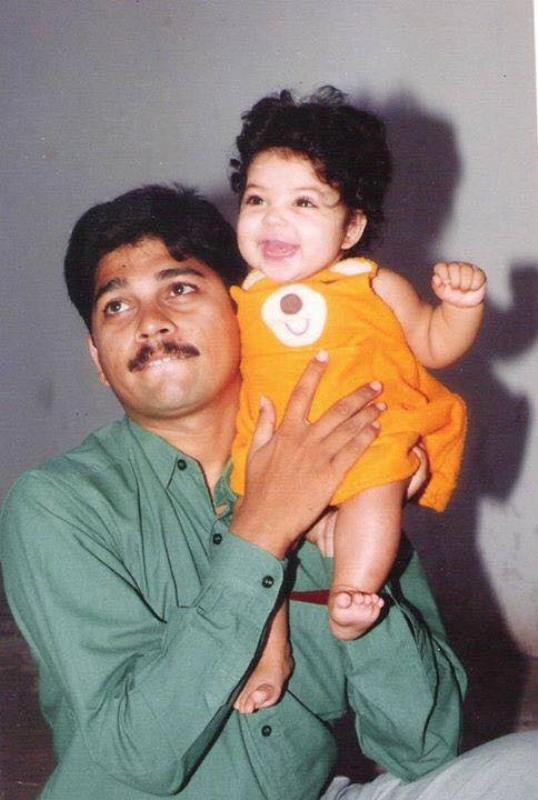 A childhood photo of Damini Bhatla with her father