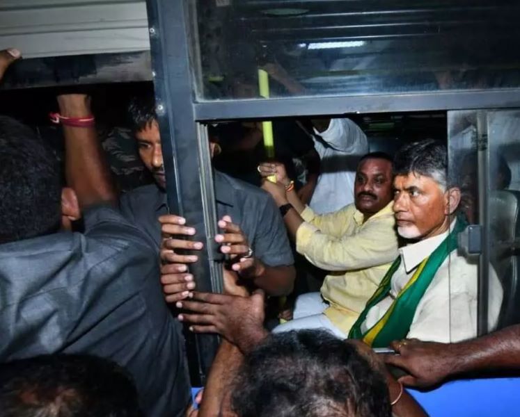 A photo of Naidu being taken after his arrest