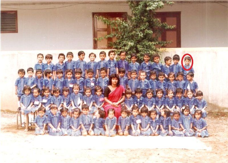 Aniket Nikam in his childhood with his classmates and teacher