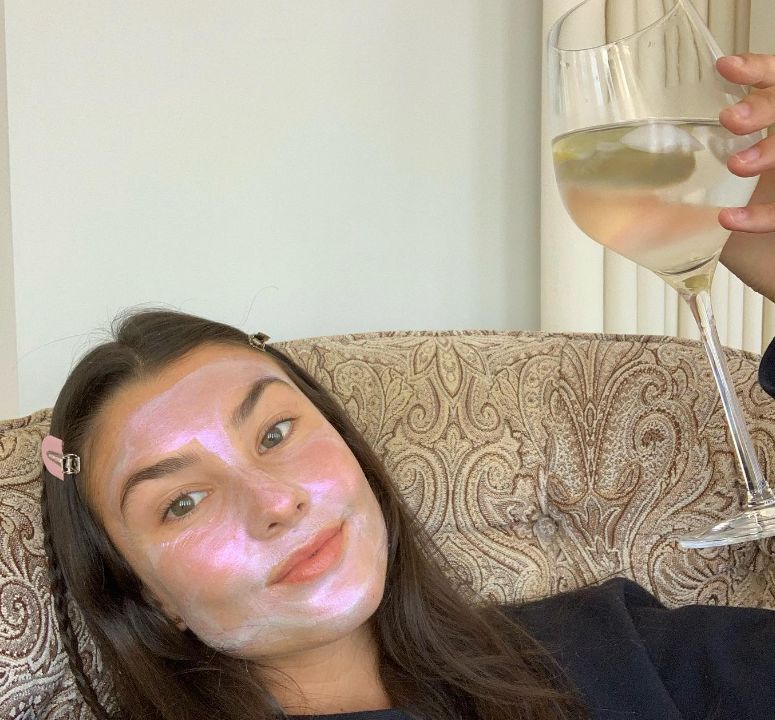 Brooke Sansone holding a glass of wine
