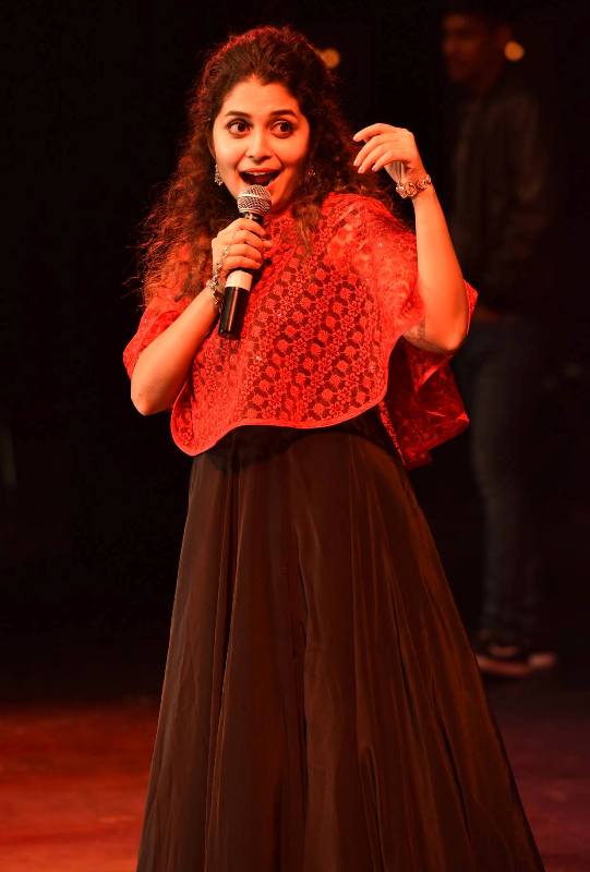 Damini Bhatla singing during a concert