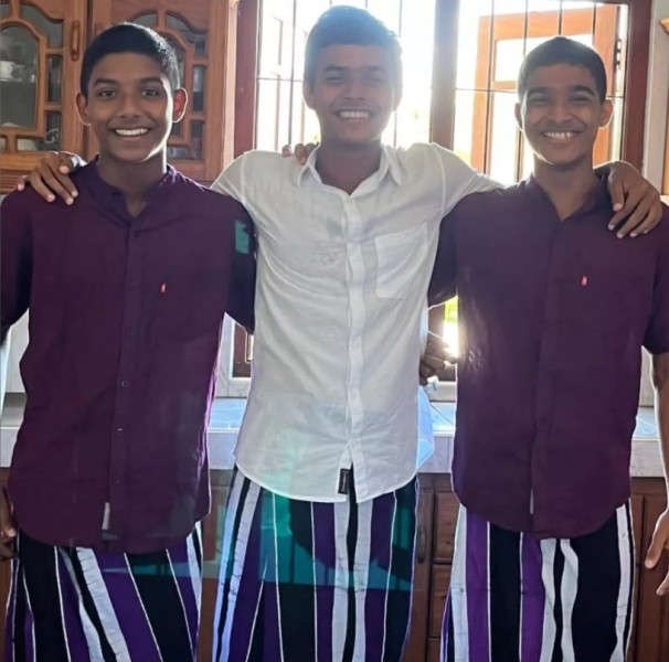 Dunith Wellalage with his younger brother, Pulina Senath Wellalage (right) and youngest brother, Chamath Chithira Wellalage (left)