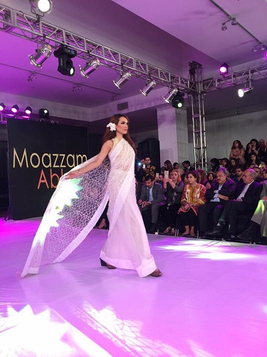 Nadia Hussain Khan walking the ramp in a fashion show