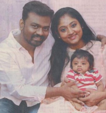Rajkumar Periasamy with his wife and son