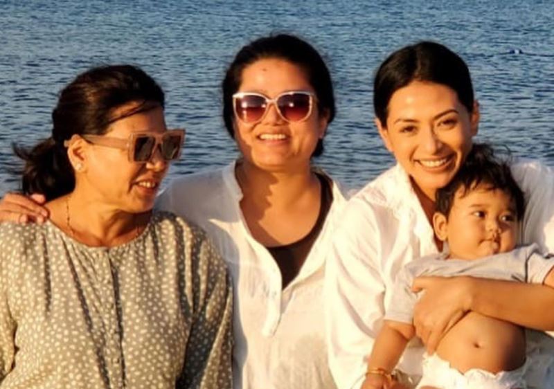 Sahana Bajracharya with her mother and sister