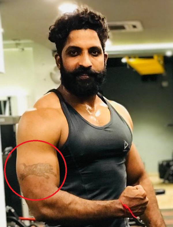 Sanjay Krishna Makthala's tiger tattoo inked on his right arm's bicep