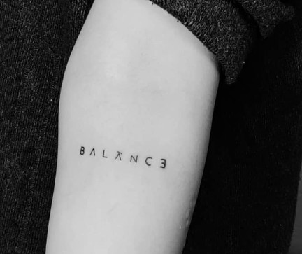 Tarjanee Bhadla featuring Balance tattoo on her arm