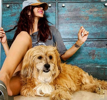 Tithi Raaj while posing with her pet dog