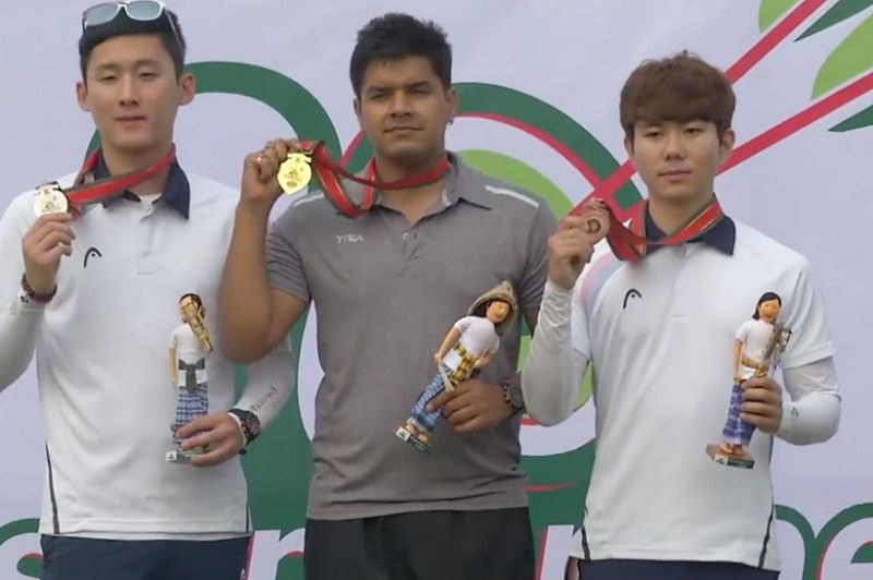 Abhishek Verma (centre) posing with gold medal at the Asian Archery Championships 2017 in Dhaka