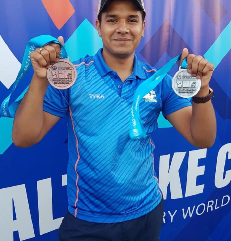 Abhishek Verma posing with bronze medal in compound mixed team event at Salt Lake City
