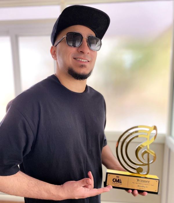 Brodha V holding CLEF Music Award 2023