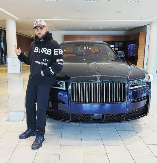 Karan Aujla with his Rolls-Royce, which he bought in 2023