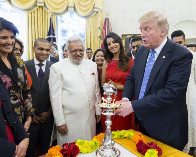 Manasvi Mamgai (in red) with Donald Trump (extreme right) during Diwali celebrations