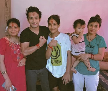 Rohit Chetry with his sisters