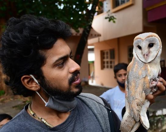 Surya Keerthi posing with a rescued Barn Owl