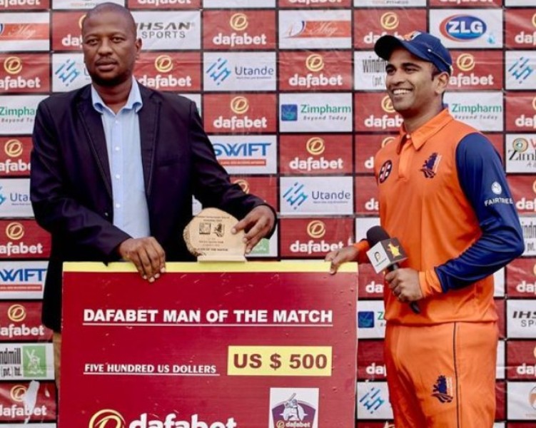 Teja Nidamanuru (right) receiving Man of the Match award after his maiden ODI century against Zimbabwe