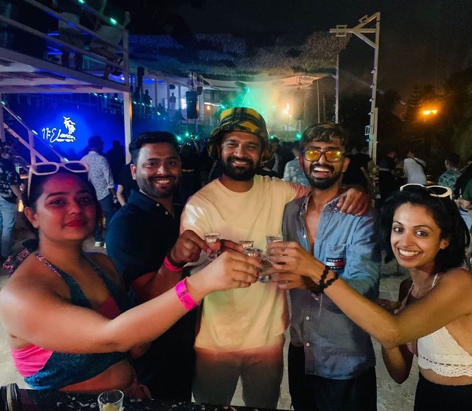 Jagat Desai (second from the right) while having vodka shots with his friends