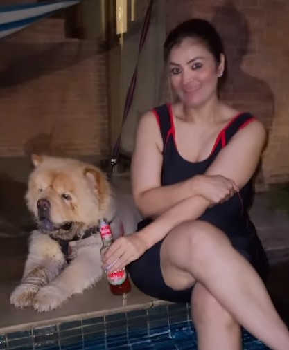 Jasmine Kaur posing with her dog and beer