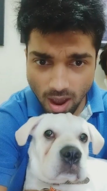 Manish Gaharwar posing with his pet dog Maxii