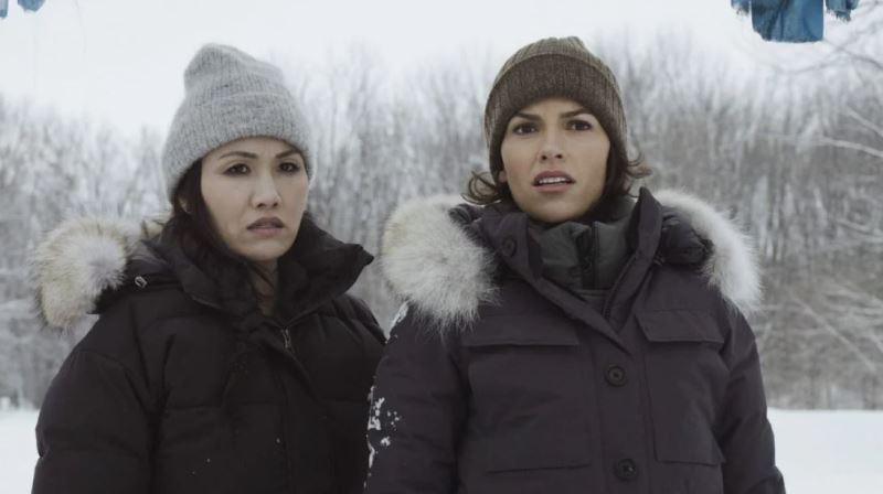 Michelle Lee (left) as Violet and Sofia Pernas as Lexi Vaziri in the American action-adventure TV series Blood & Treasure (2023)