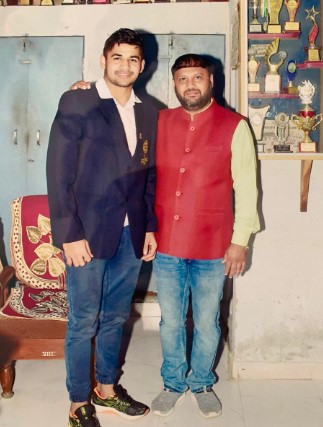 Naveen Kumar with his coach