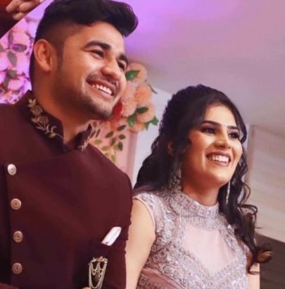 Naveen Kumar with his wife, Meenakshi, on their wedding day