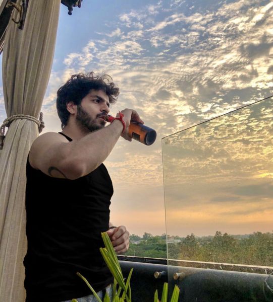 Nikhil Mehta drinking beer on a vacation
