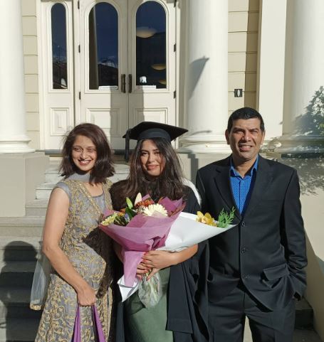 Ravi Krishnamurthy with his wife and daughter