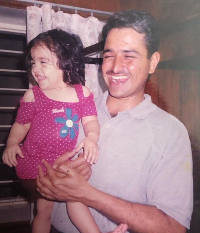 Rukmini Vasanth as a child with her father