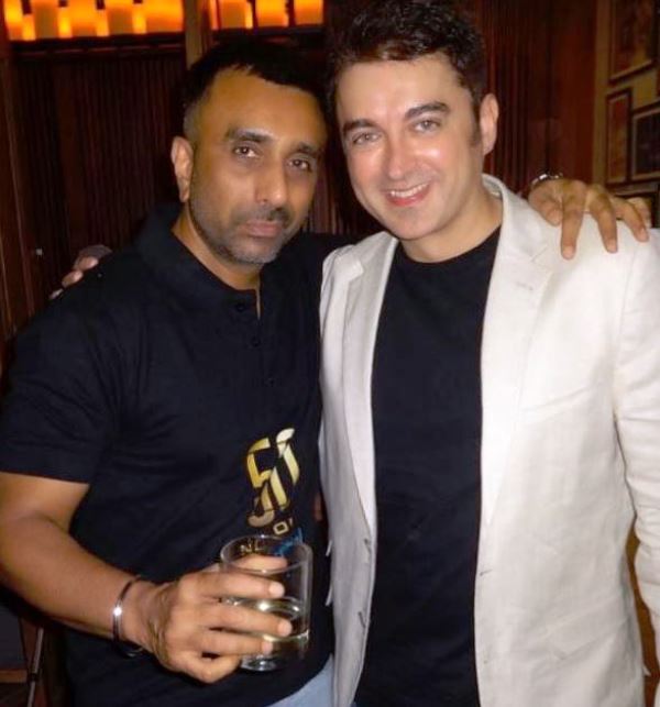 Sanjay Gadhvi (left) consuming alcohol