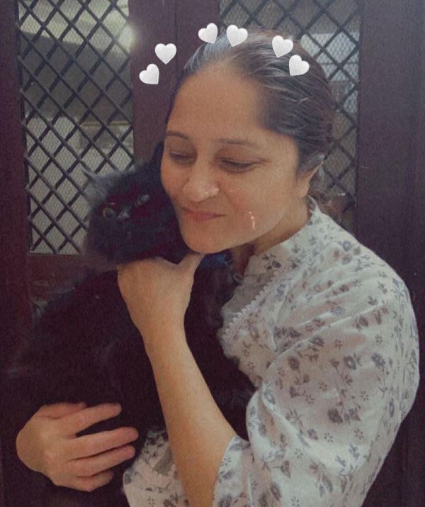 Zakiya Sultana with her pet cat Kashaf Jumma