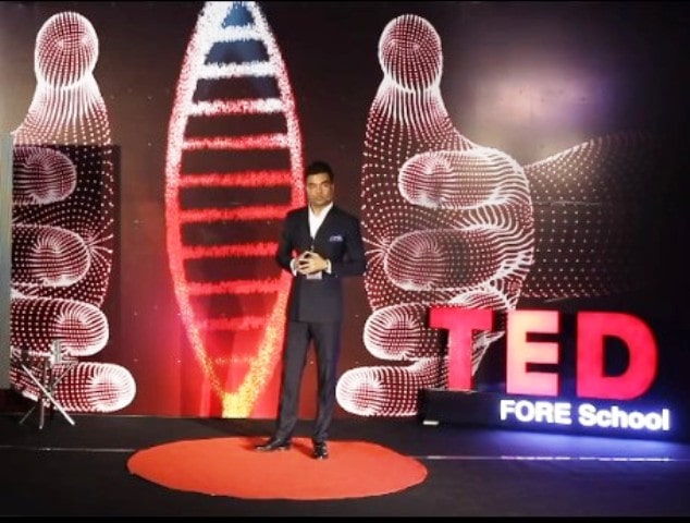 Abhishek giving a speech at TEDxFORESchool