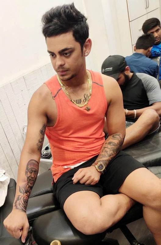 Ishan Kishan showing his 'rose' and 'Sai Baba' tattoo on his right forearm